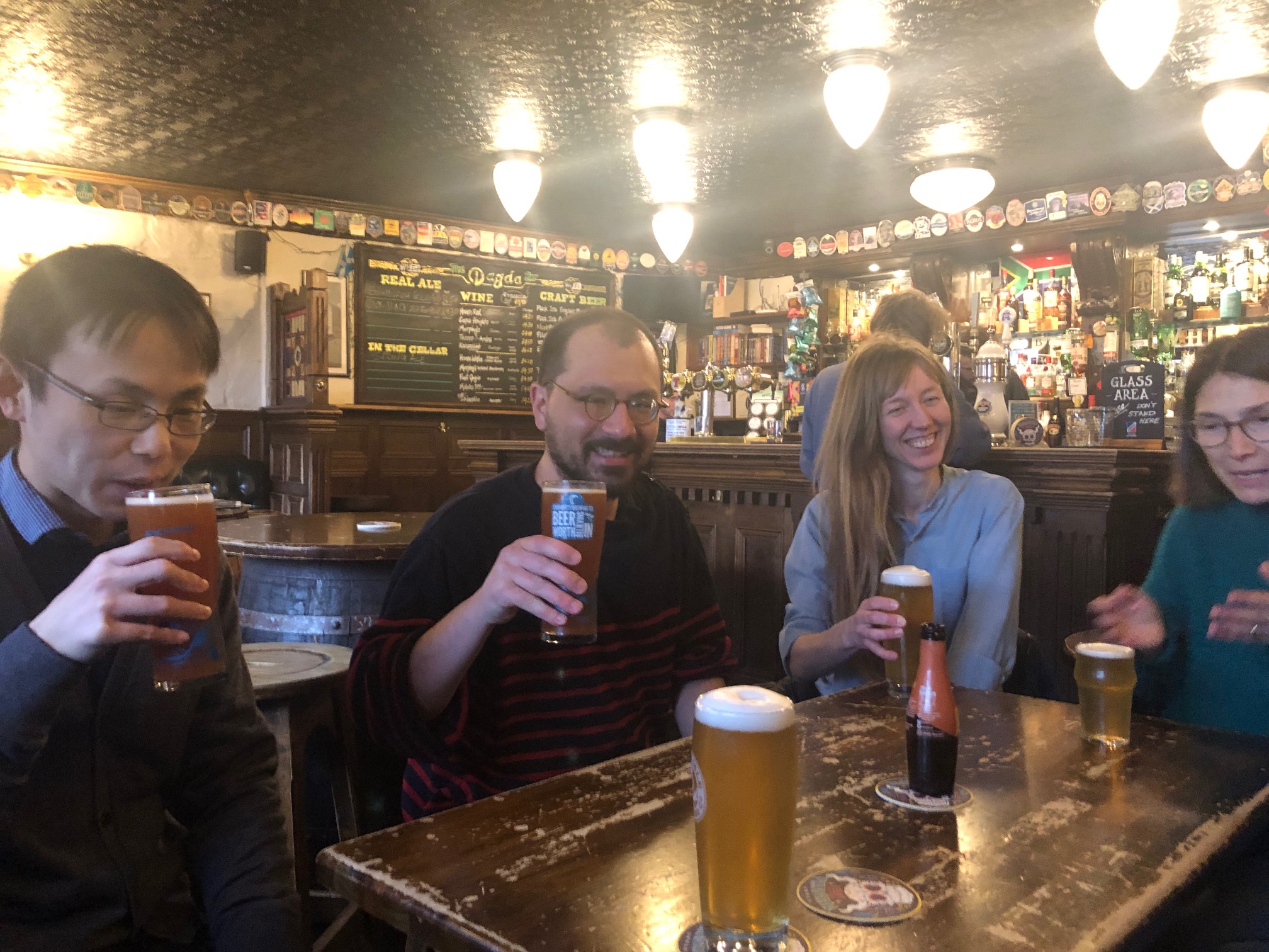 lab members and collaborators enjoying beer